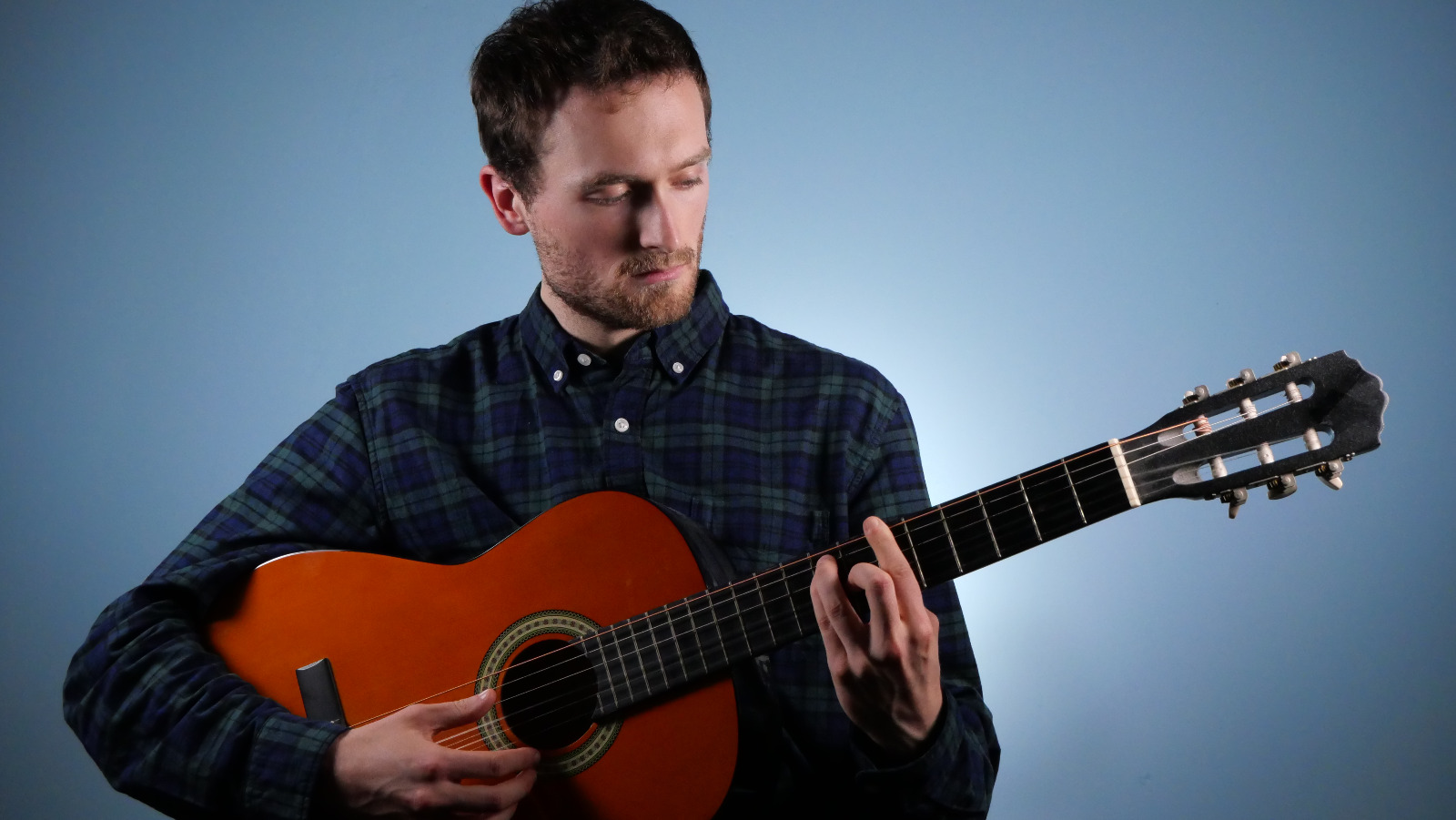 Sam playing guitar